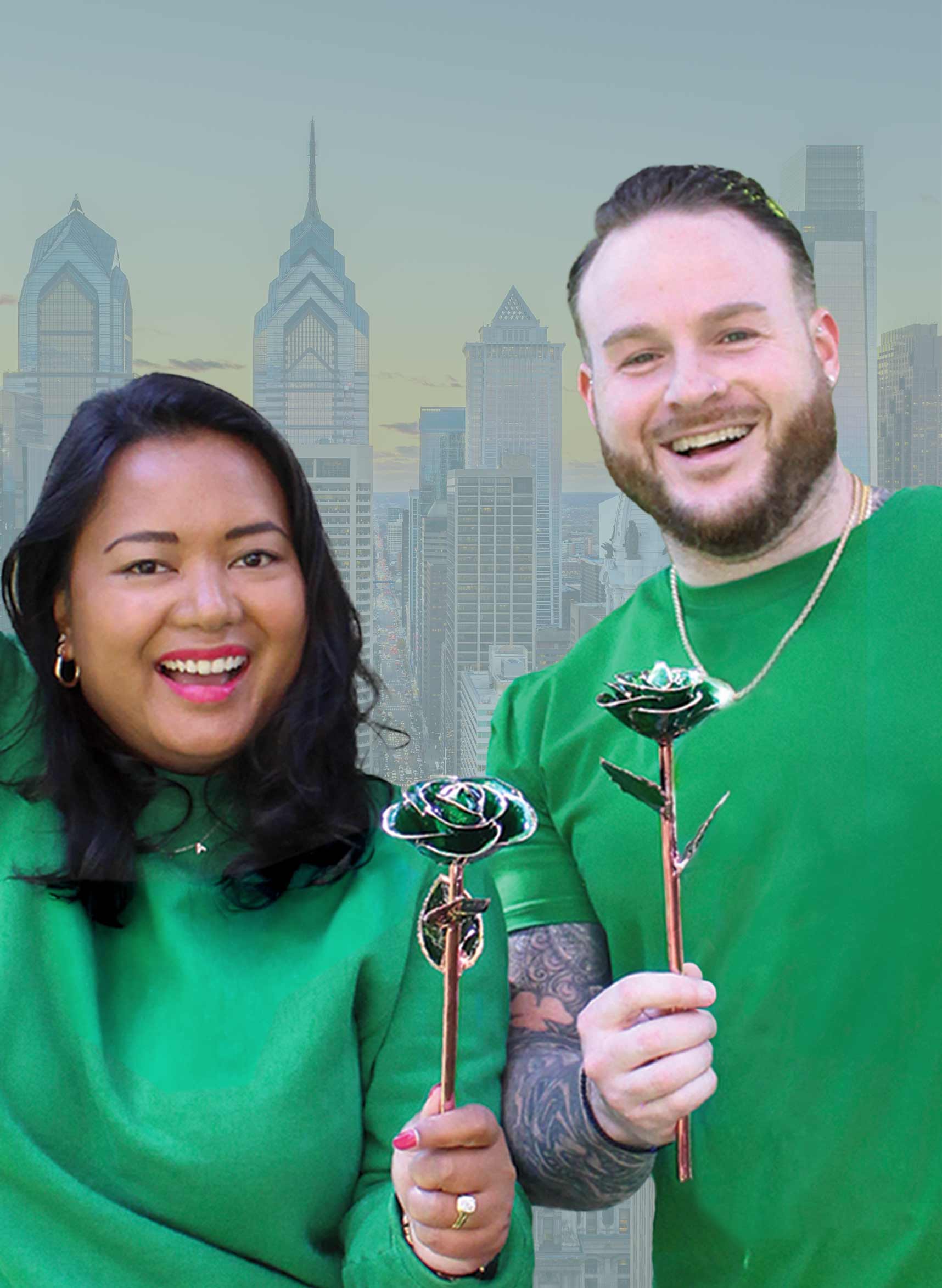 Eagles fans wearing green and holding our Emerald City Rose Gold Dipped Rose.