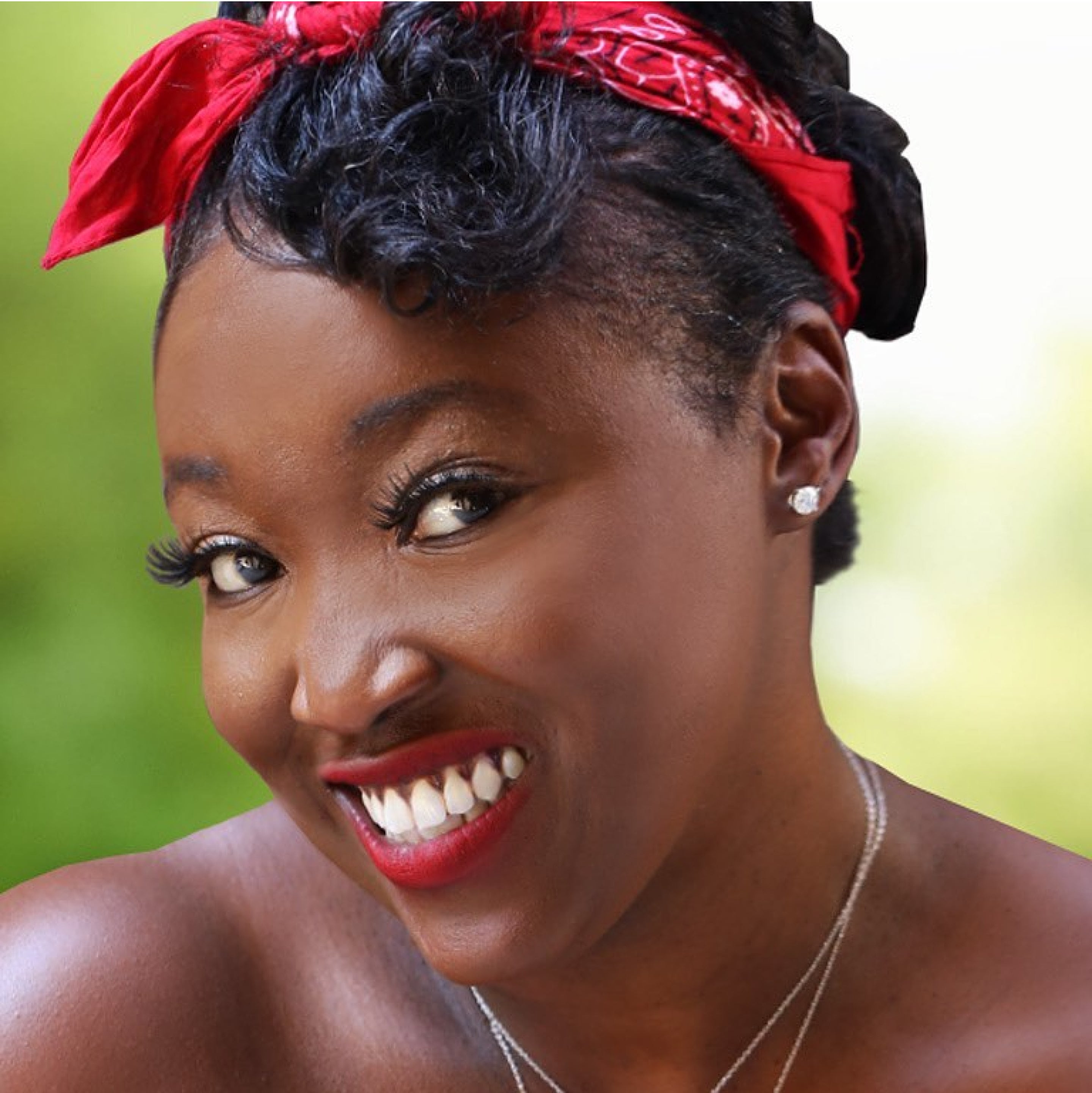 A happy woman wearing our sparkling diamond studs.