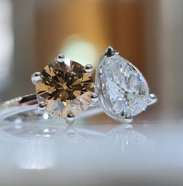 Two engagement rings representing different shapes and colors based on the groom and brides preference.
