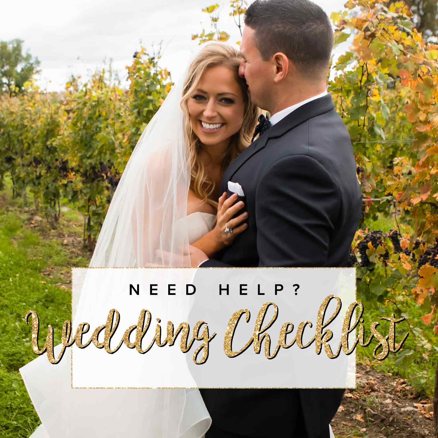 A groom smiling with his happy brides hand on his chest.