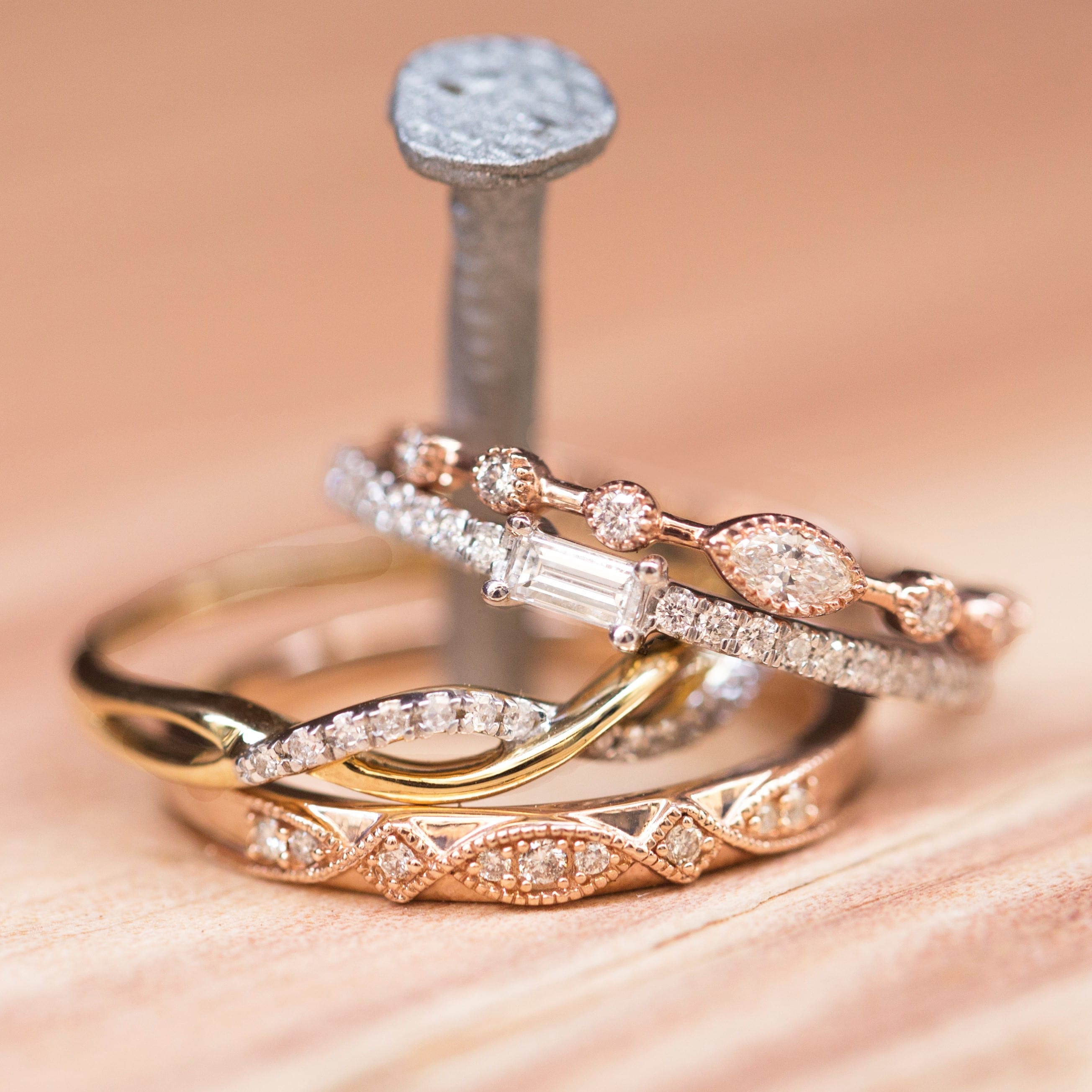 Four bands stacked on top of a nail to show how the stackable style works.