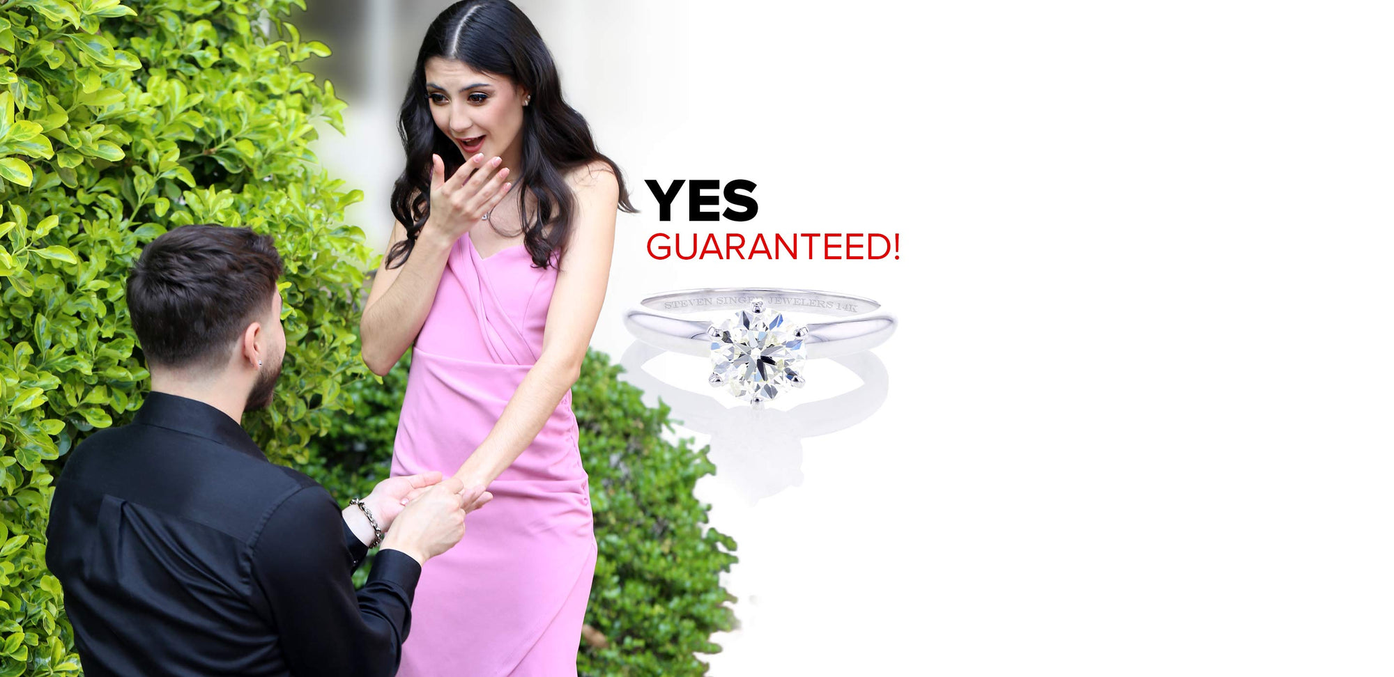 A man on his knee proposing to his girlfriend and our most classic engagement ring, Christa Ready for Love Diamond Engagement Ring.