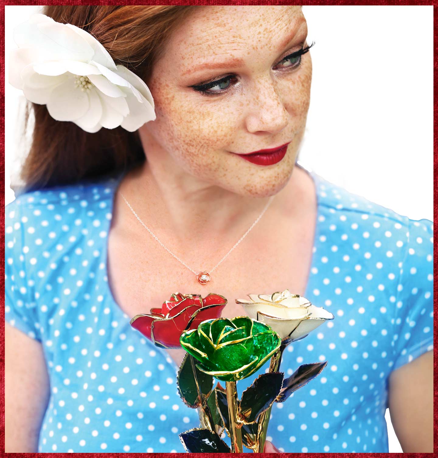 A lady with a flower in her hair holding a bouquet of our 24 karat yellow gold dipped roses in christmas colored petals of red, white and green. 
