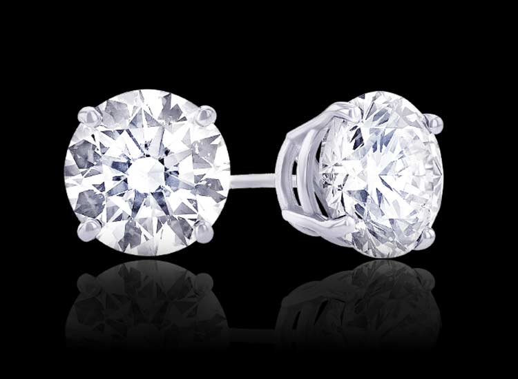 Picture of a pair of diamond stud earrings.