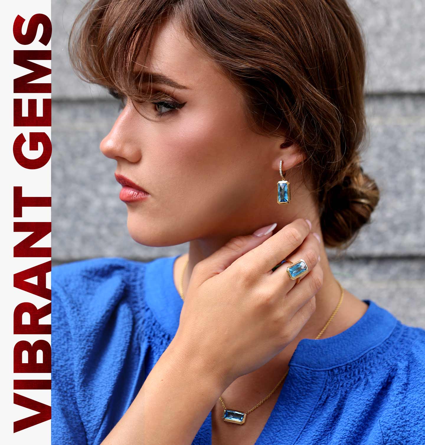 A brunette with her hair pulled back showing off beautiful Blue Topaz Jewelry from our Color Jewelry Collection.