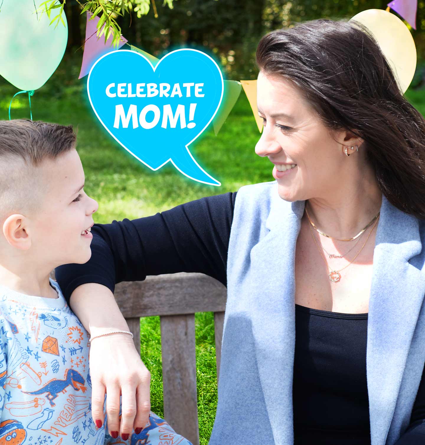 A mom smiling at her son wearing jewelry from our Top 12 Gifts for Mother's Day.