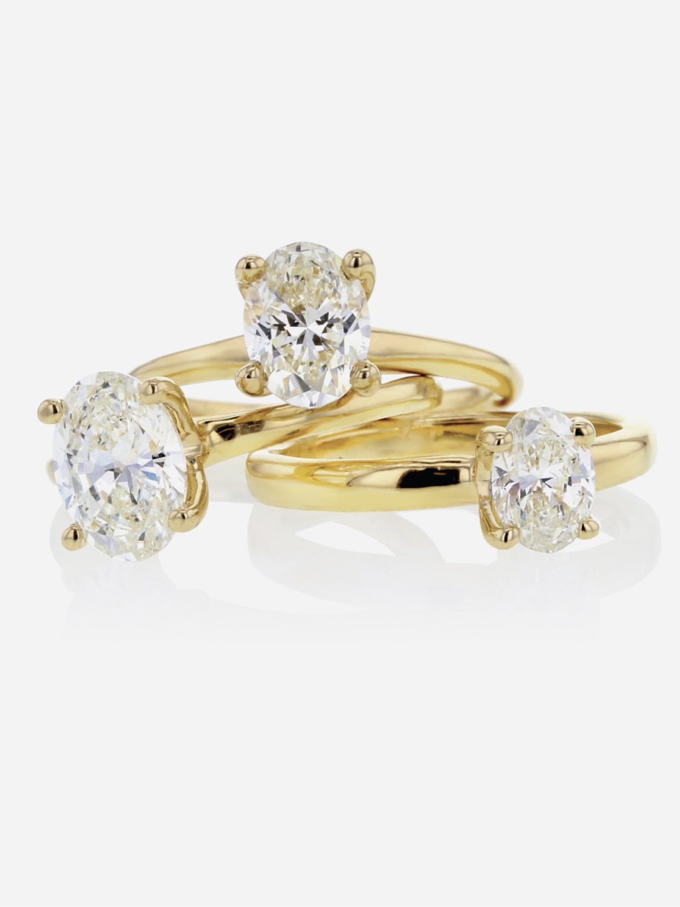 Three diamond golden rings stacked on top of eachother 