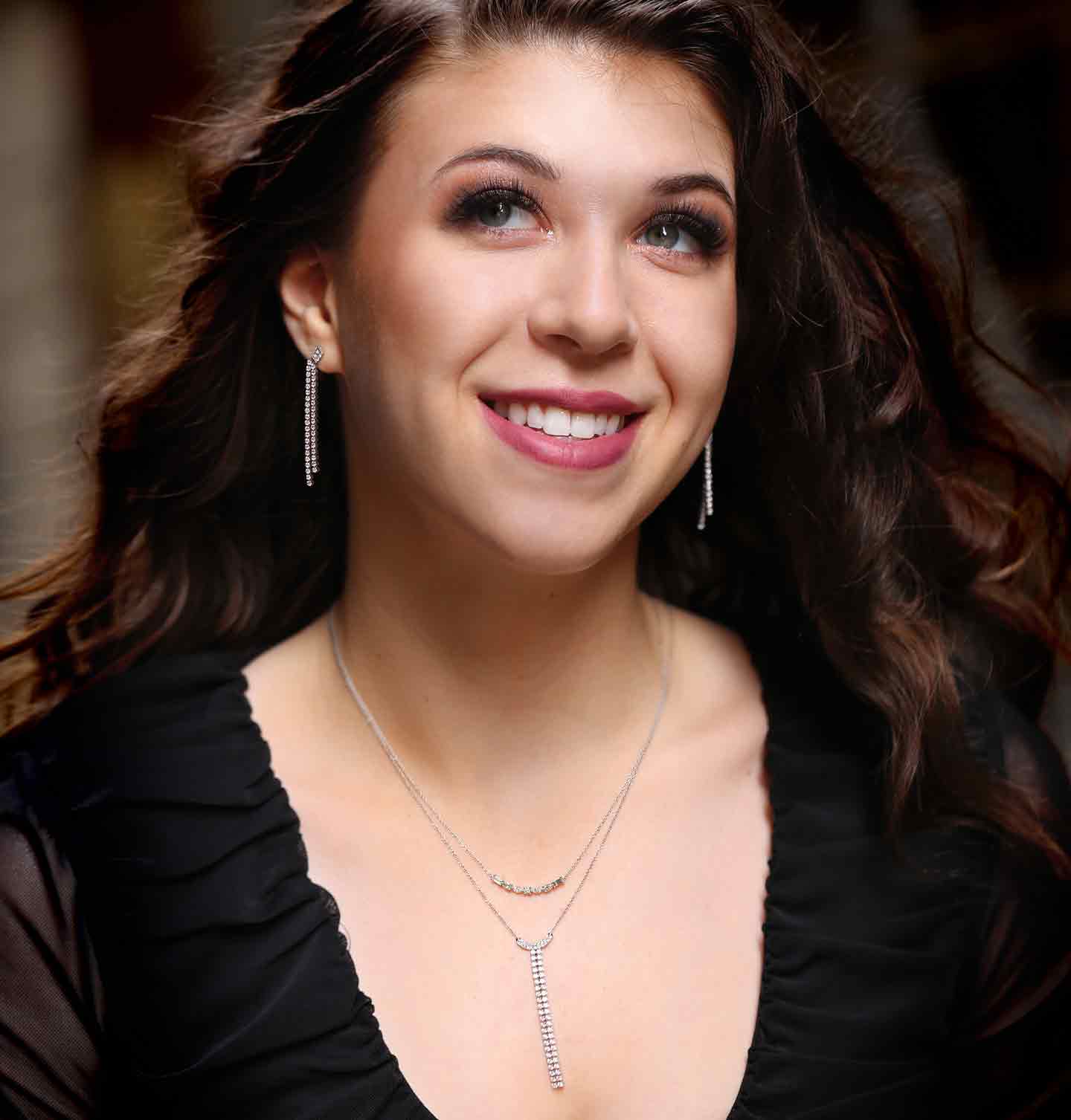 A woman wearing our trendy Crescent Diamond Jewelry Set.
