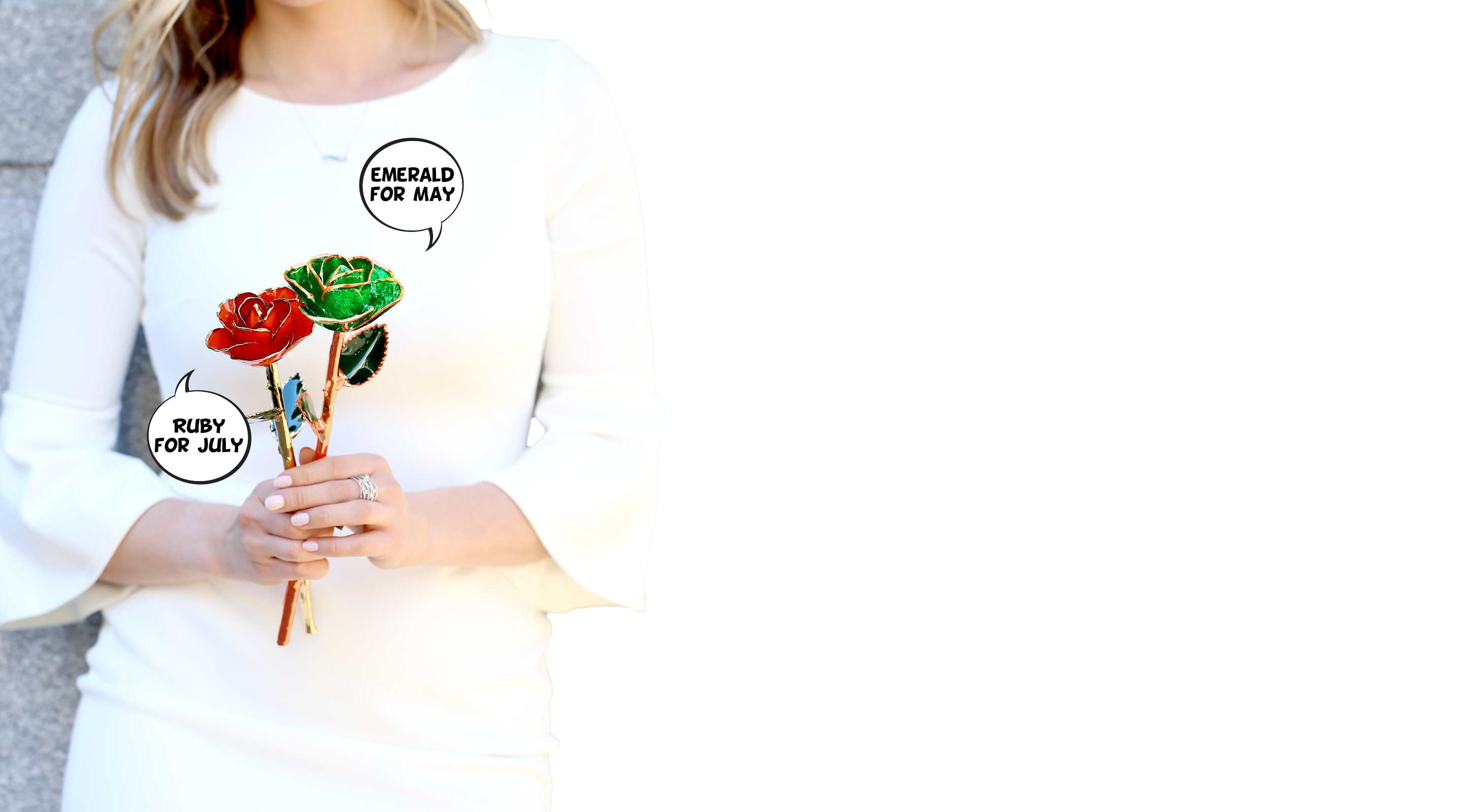 A girl in a white dress holding an Emerald Green and Ruby Red Gold Dipped Rose.