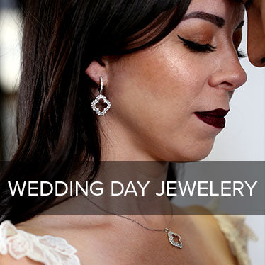A bride wearing a beautiful clover diamond jewelry set on her wedding day.