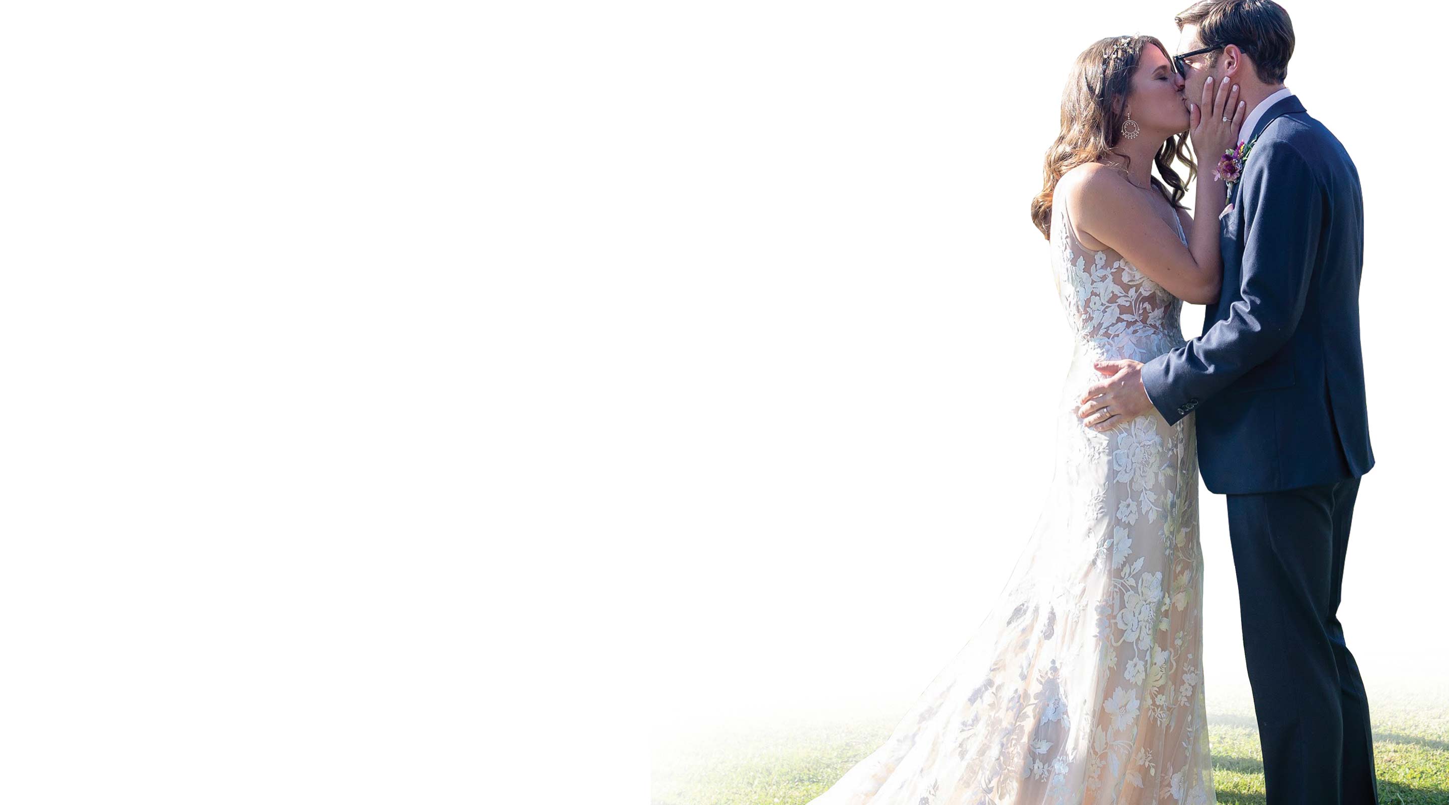 A couple kissing on their wedding day.