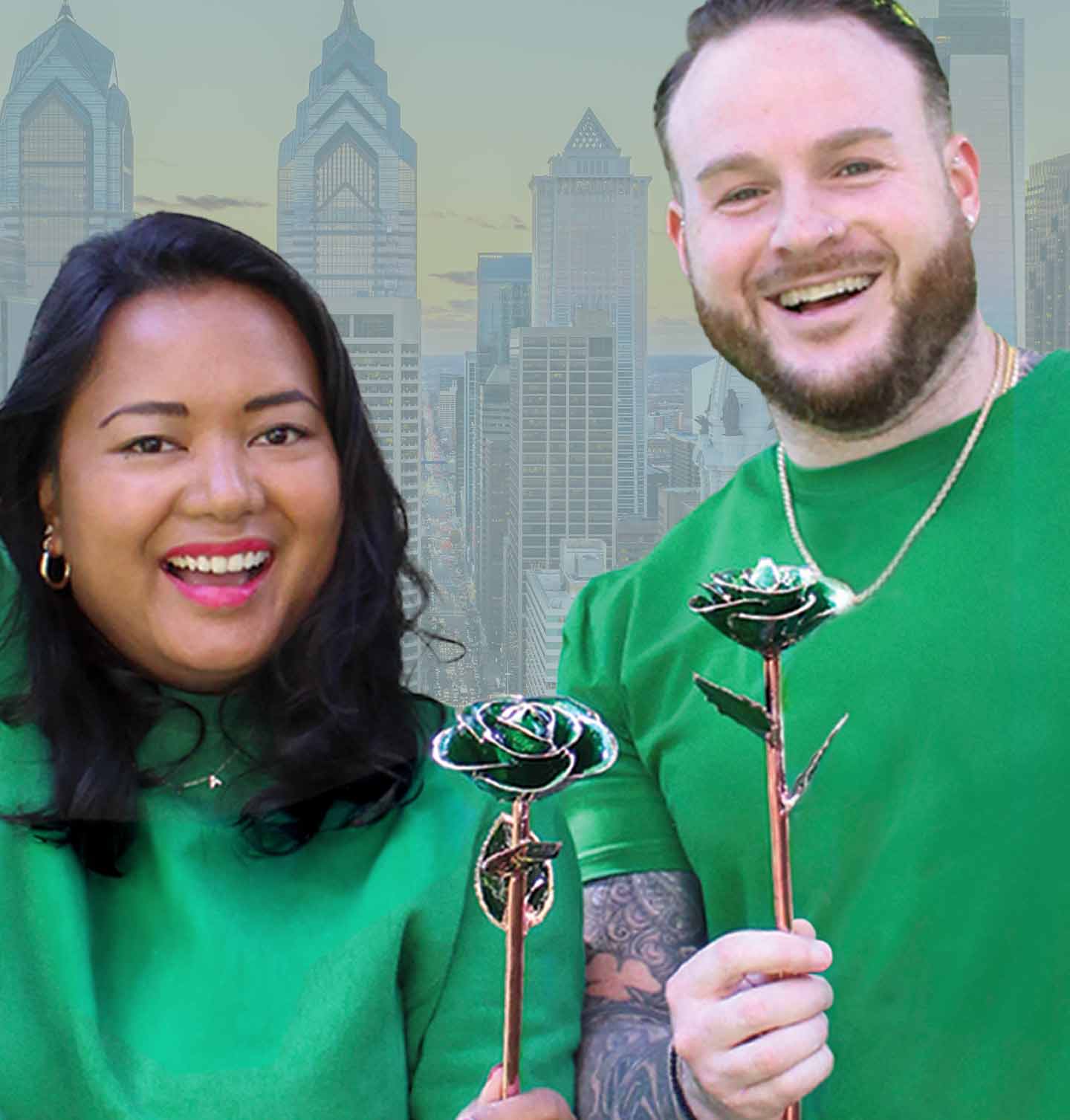 Two football fans in Philadelphia holding our birthstone rose for May, Emerald City Rose Gold Dipped Rose. A portion of proceeds go towards Eagles Autism Foundation!